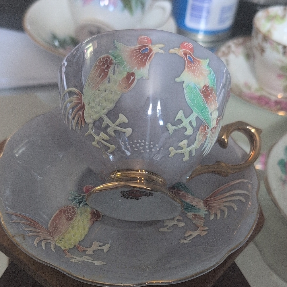 Elegant Gray Tea Cup with Rooster Design